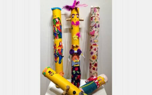 3D sculpture incorporating found objects on long tube shapes.